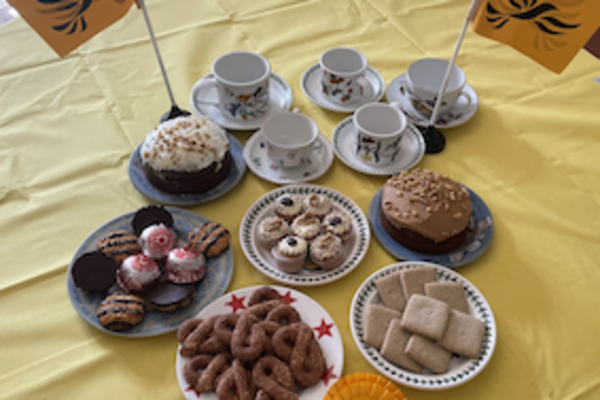 Photo of tea cups and cakes